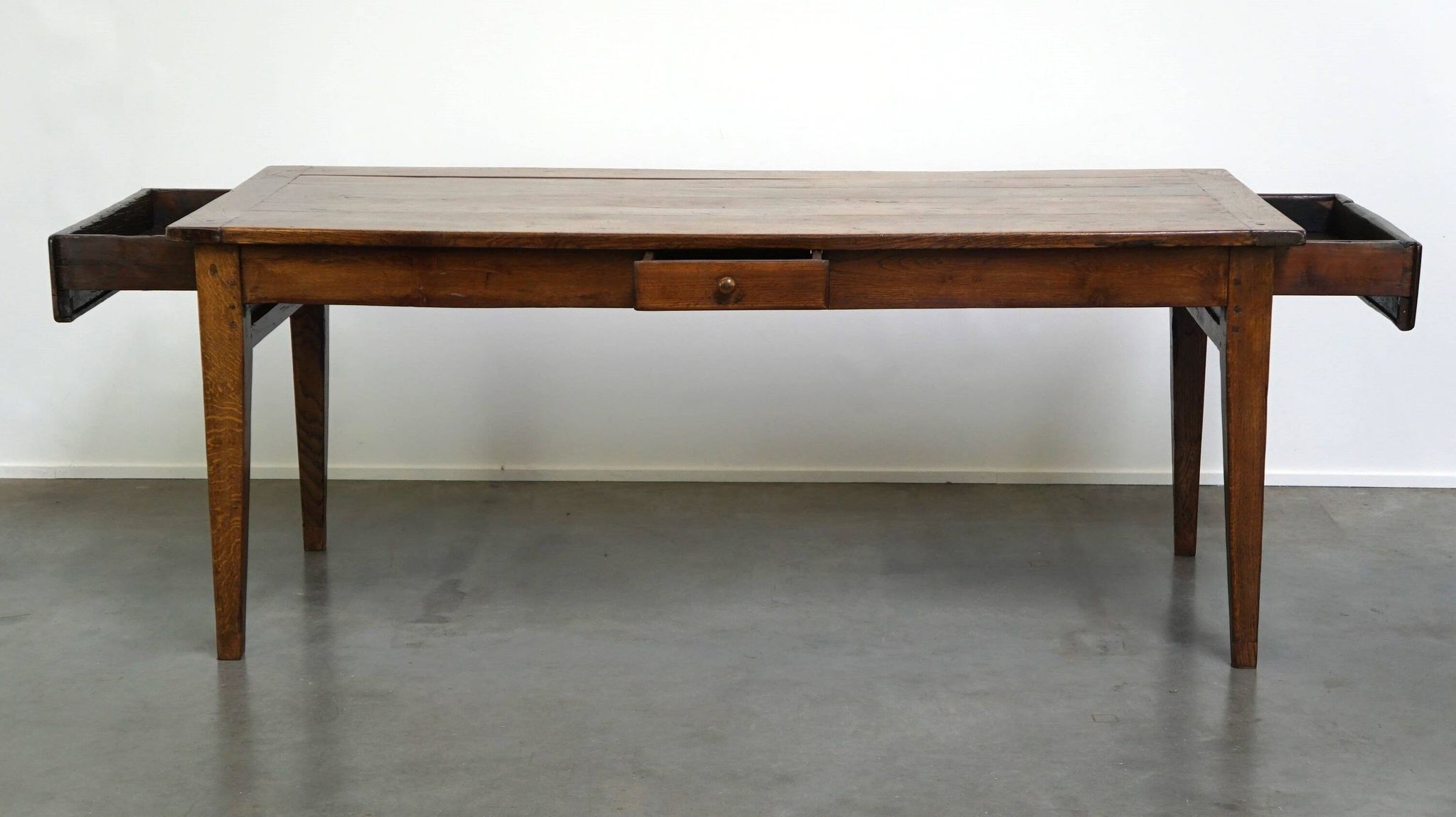 antique French oak dining table with 3 drawers and an exquisite patina