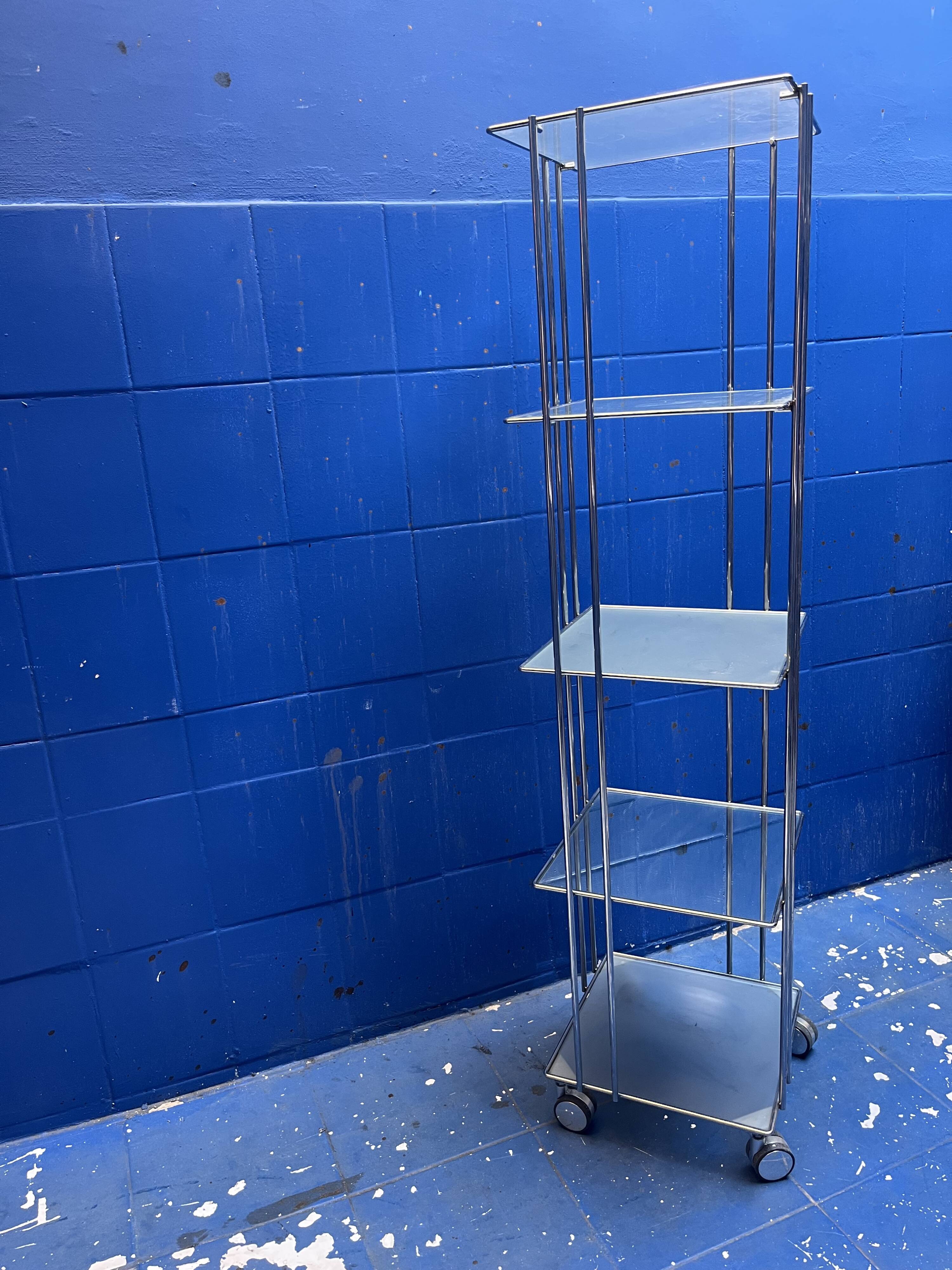 chrome and glass shelving unit on wheels from the 90s
