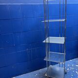 chrome and glass shelving unit on wheels from the 90s