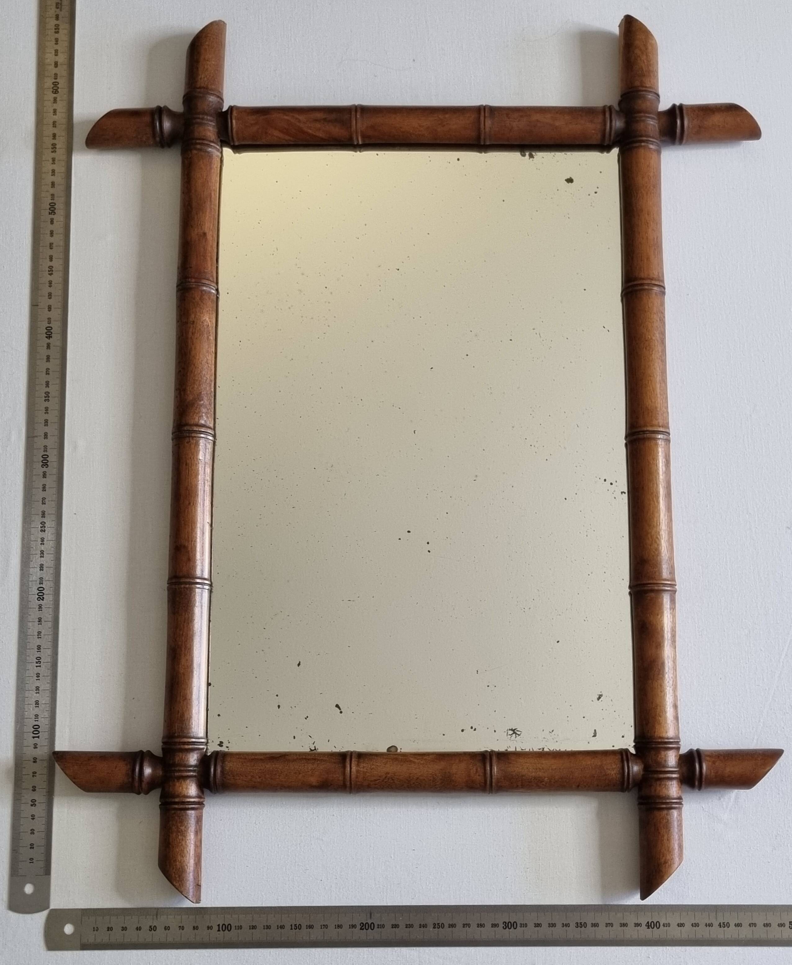 Miroir mural Napoléon III en bois tourné façon bambou XIXe siècle, 49x65 cm