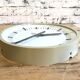 Beige industrial bakelite wall clock from Pragotron, 1970s