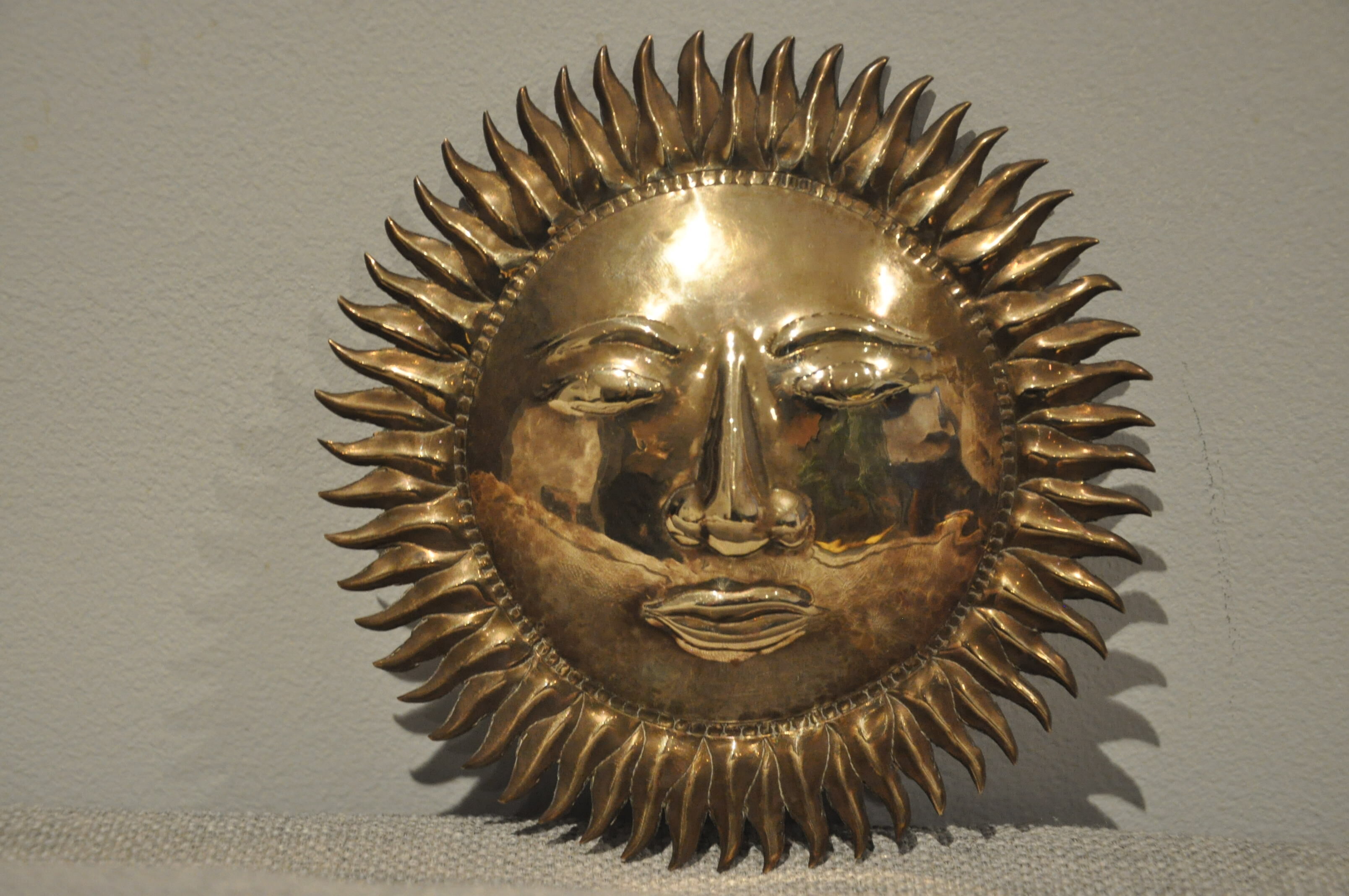 Vintage brass sun