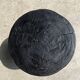 Black mango wood tripod side table with a semi-spherical top, height: 45 cm, diameter: 44 cm.