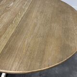 Round extendable oak dining table