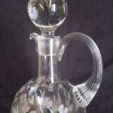 Wine carafe on foot, in cut and enameled glass