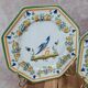 Set of 12 small antique plates by Alfred Renoleau, different designs.