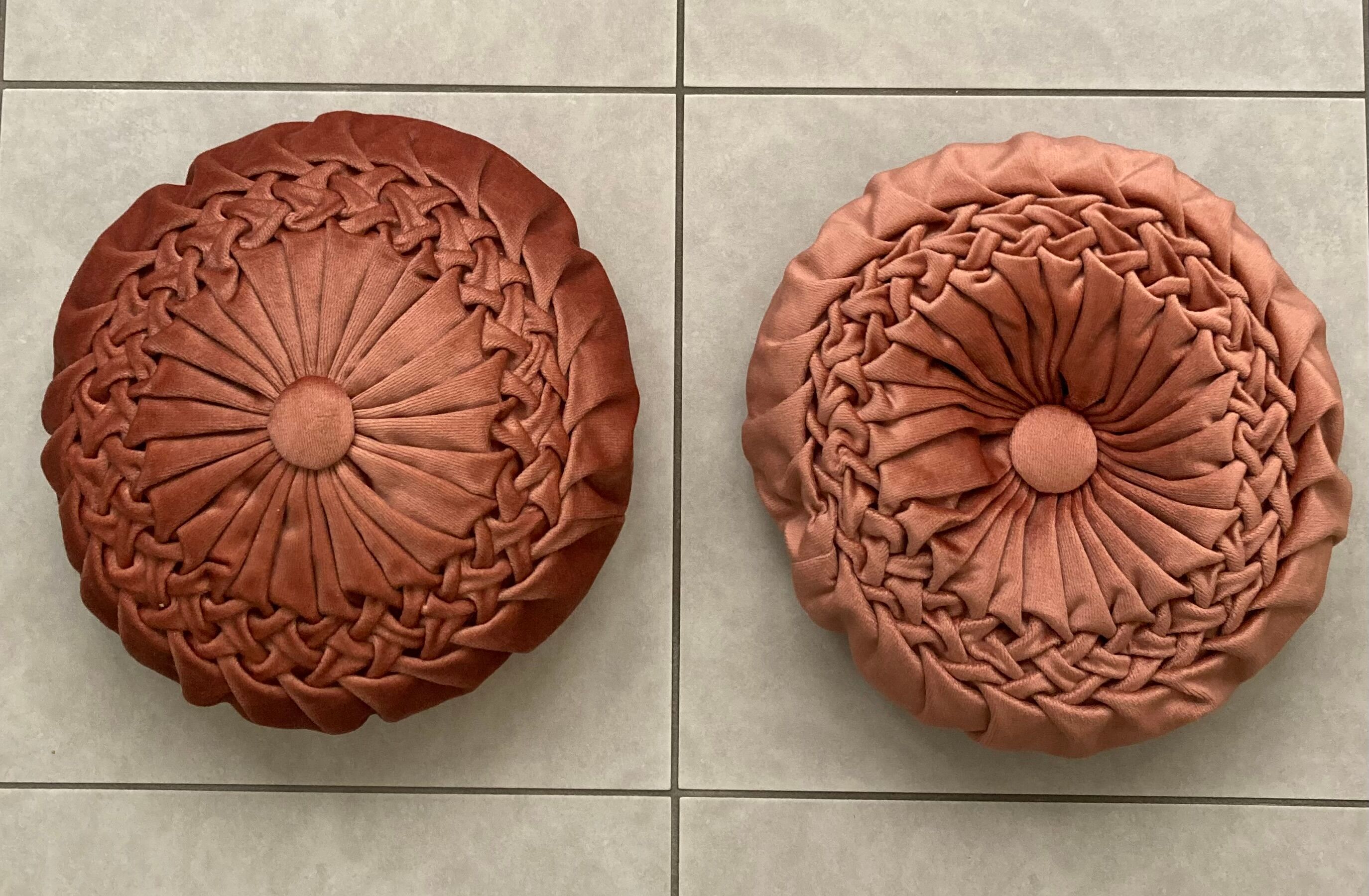 Pair of round vintage pleated velvet cushions