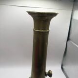 Candle holder with a pusher