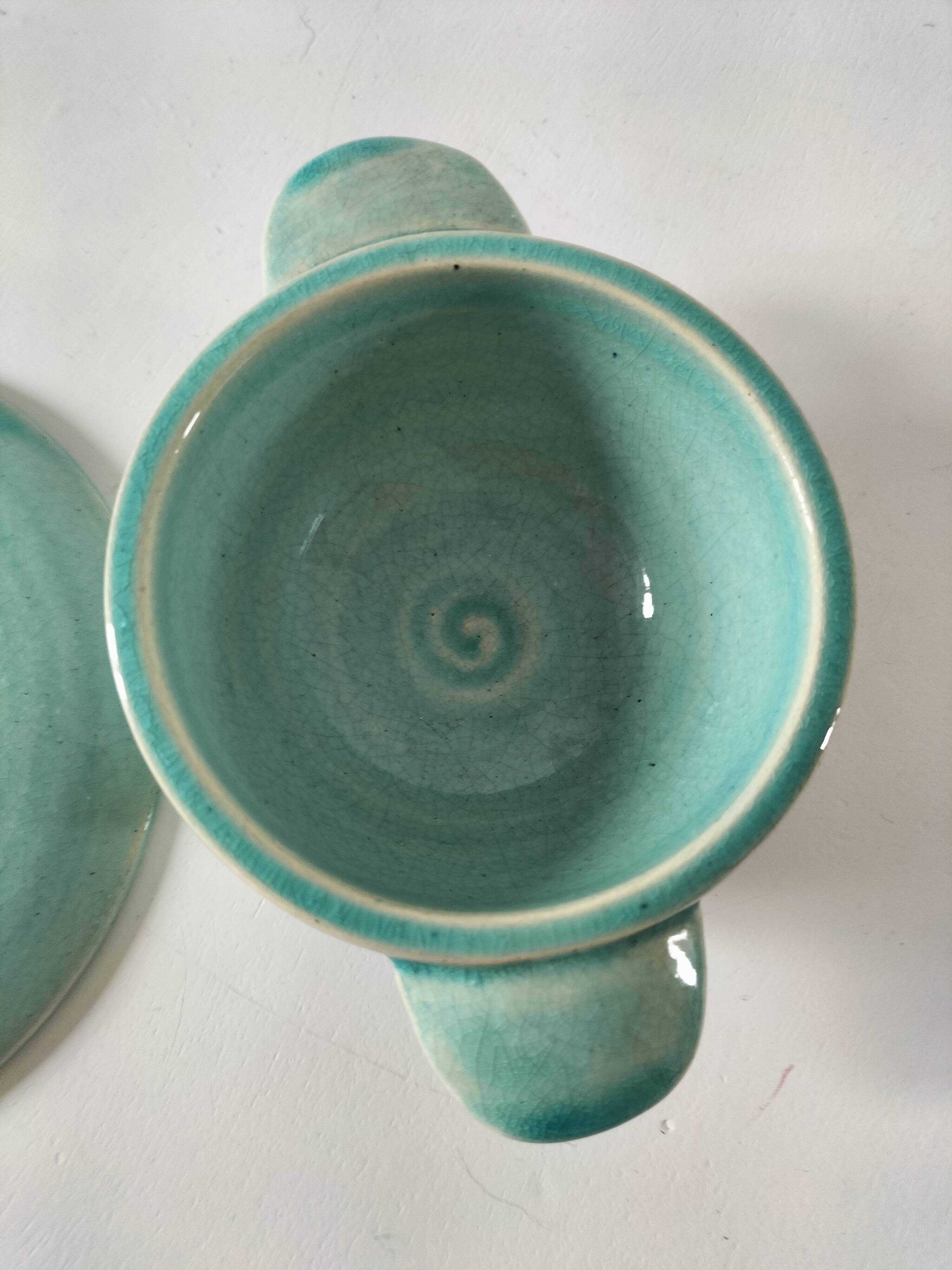 Earthenware bowl and saucer in glazed water green ceramic.