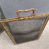 Antique fireplace screen in copper and brass from the 19th century.
