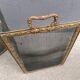 Antique fireplace screen in copper and brass from the 19th century.