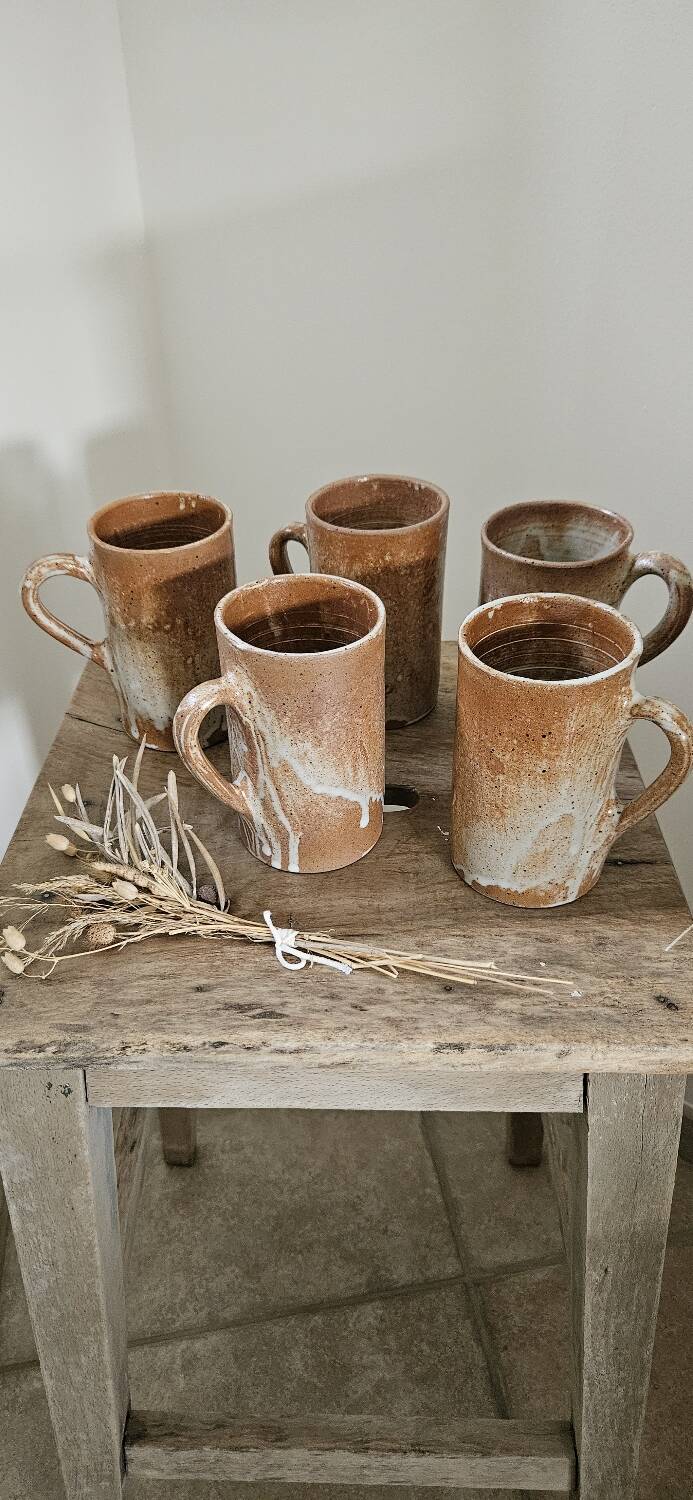 Set of 5 vintage handcrafted stoneware mugs in beige, pink, and white glazed stoneware