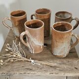 Set of 5 vintage handcrafted stoneware mugs in beige, pink, and white glazed stoneware