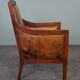Armchair in sheepskin with wood