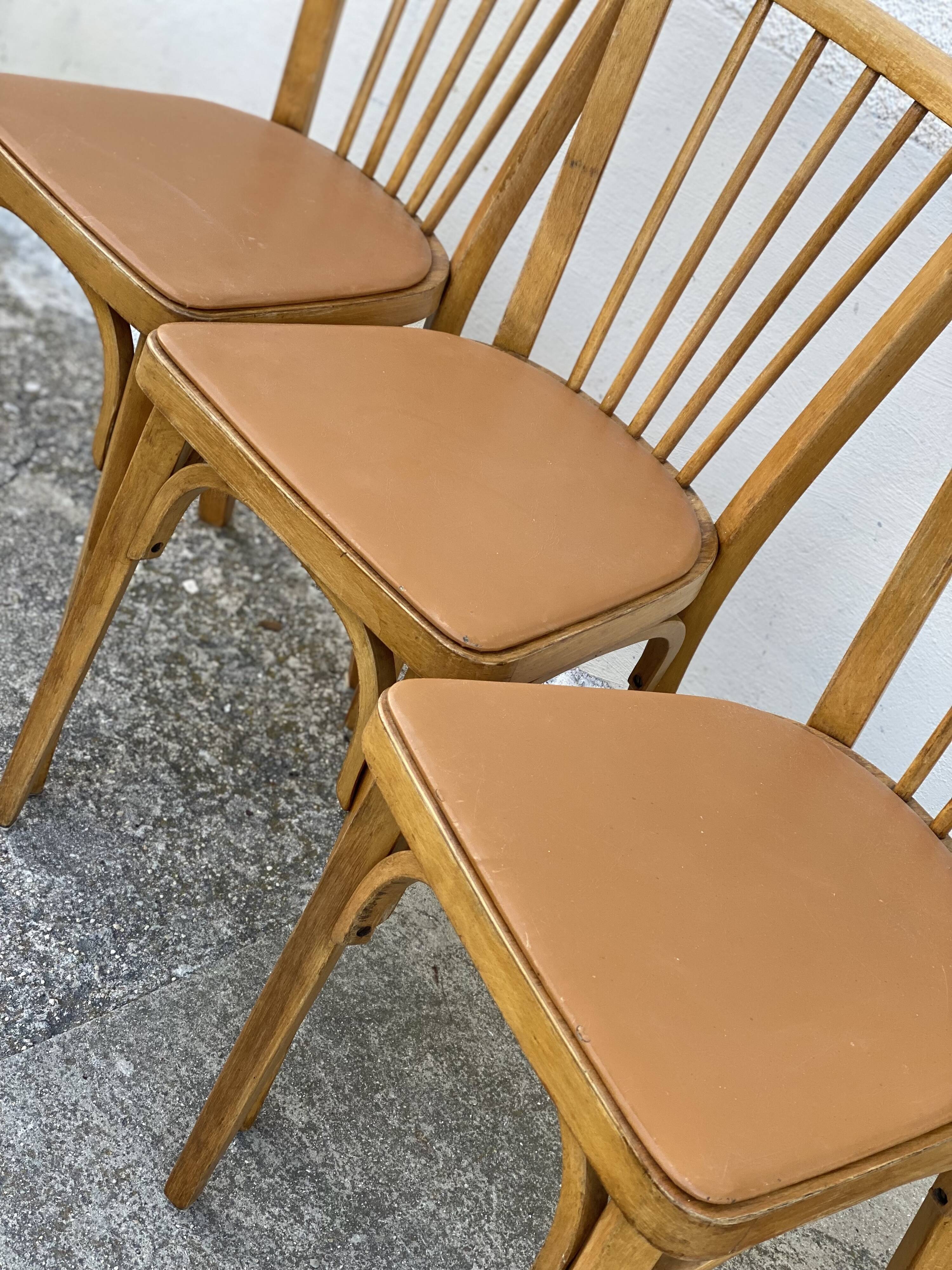 Série de 4 chaises bistros vintage 1950-60 assises Skaï