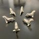 6 dolphin-shaped knife holders in silver-colored metal