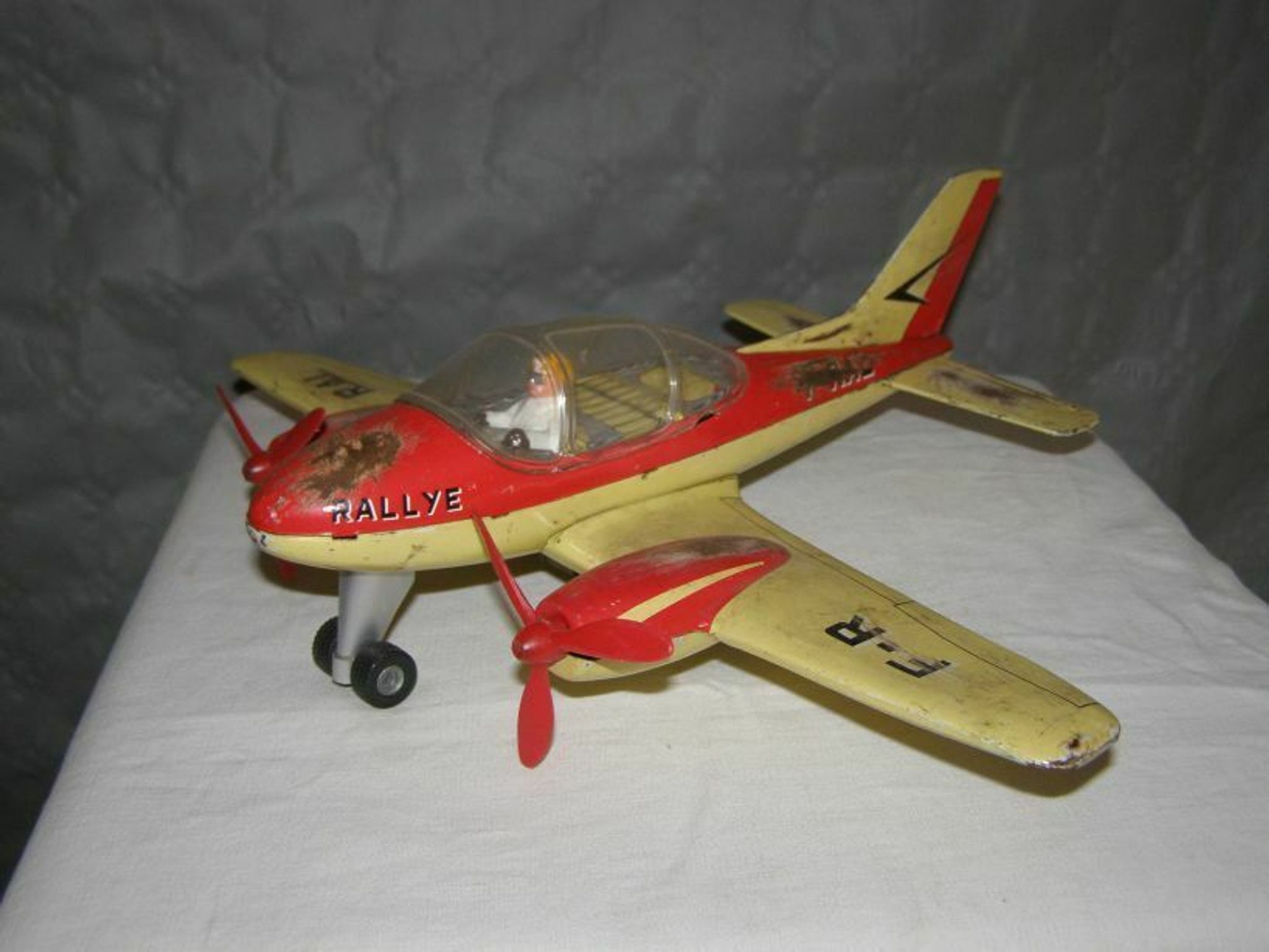 Old metal Joustra toy; propeller aircraft with its pilot friction mechanism