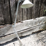 Old articulated workshop lamp in painted metal