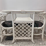 Rattan head-to-head table with vintage armchairs