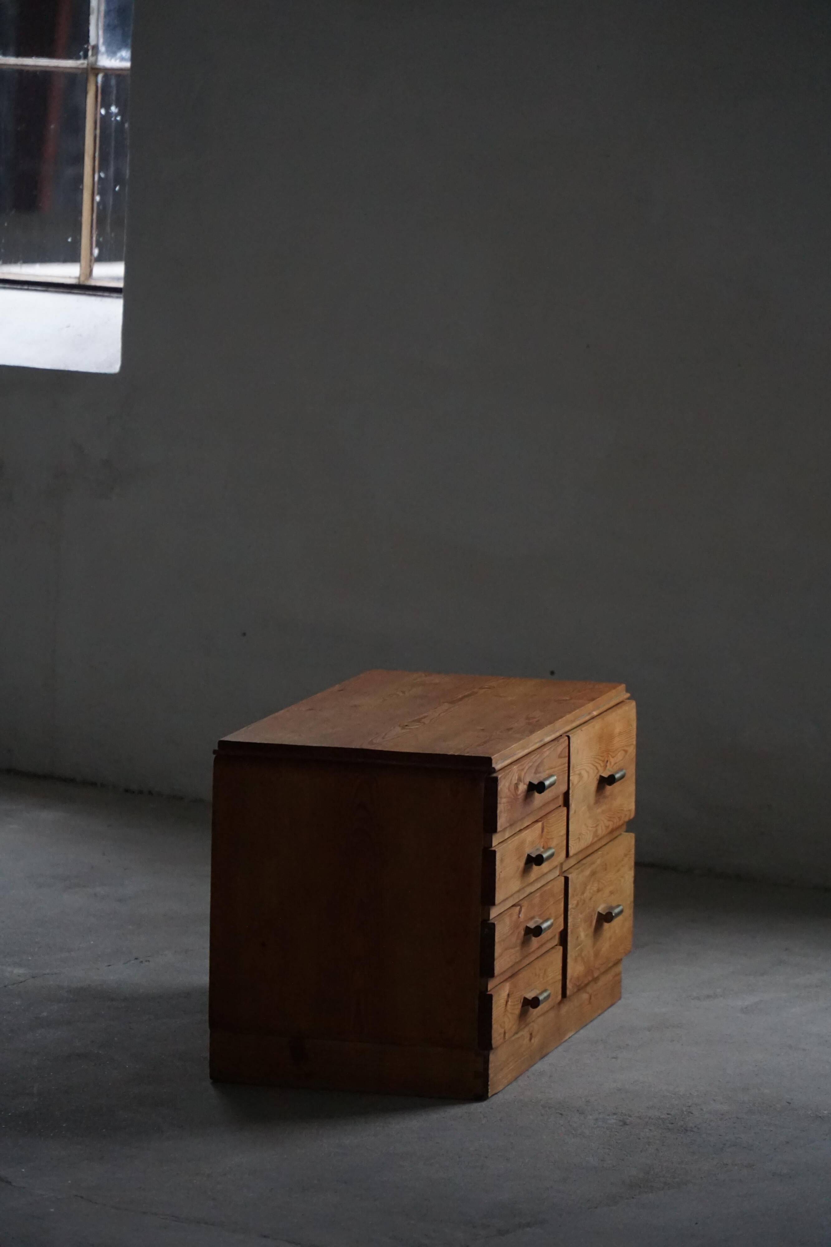 Mid-20th century Art Deco chest of drawers in pine with metal handles, 1940s.