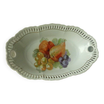 Pierced porcelain basket decorated with fruit still life.