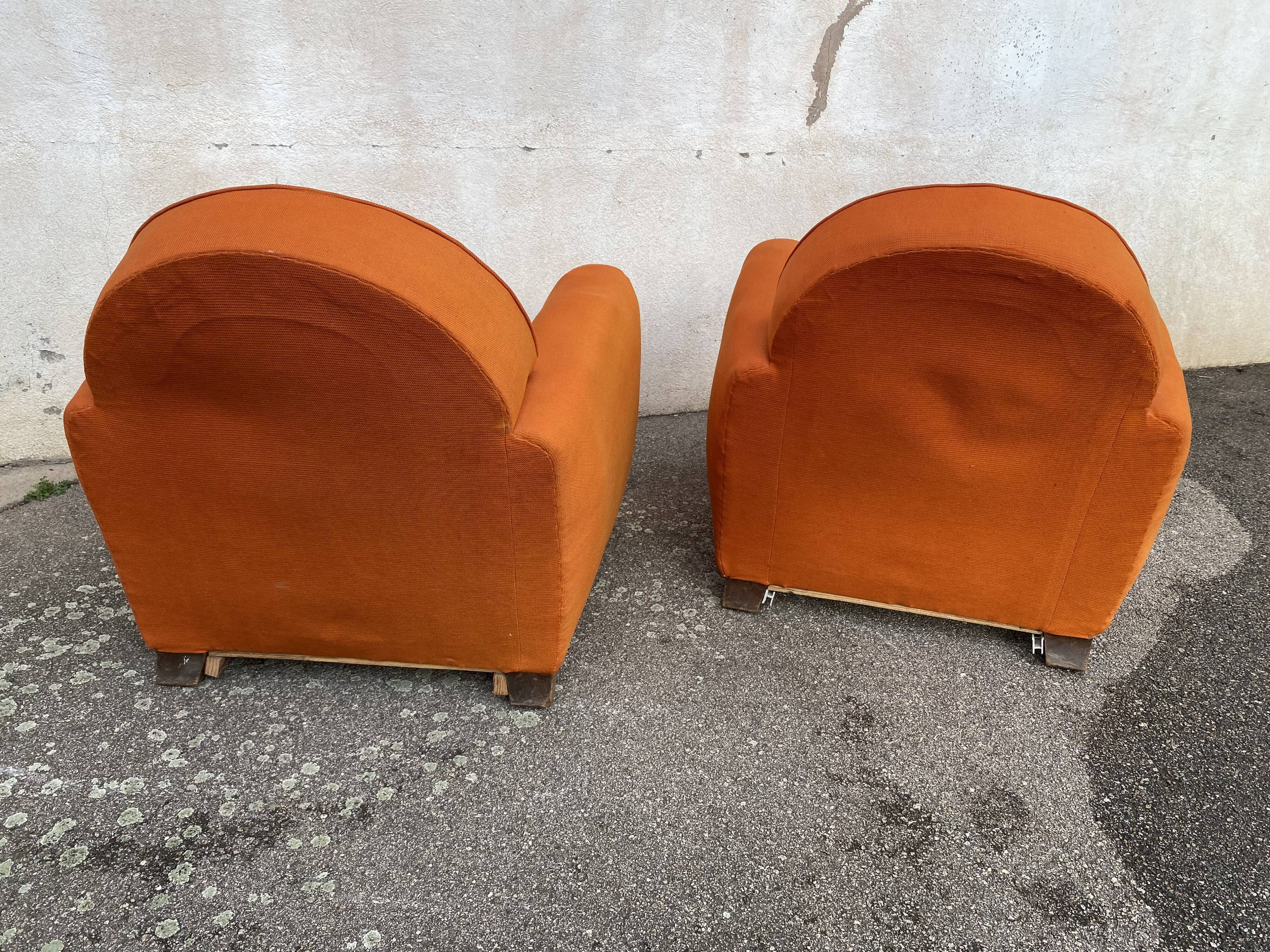 Pair of vintage orange club chairs