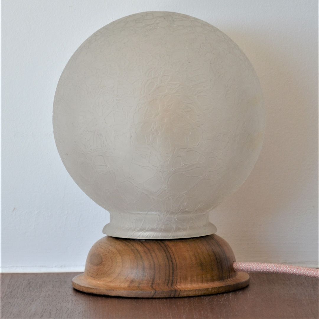 White glass globe table lamp with geometric reliefs