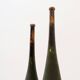 Pair of large wooden practice skittles on a base, early 20th century