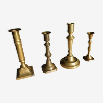 Set of 4 old candle holders in golden brass