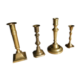 Set of 4 old candle holders in golden brass