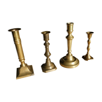 Set of 4 old candle holders in golden brass