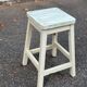 Rustic square farmhouse stool in patinated white wood from the 1960s.
