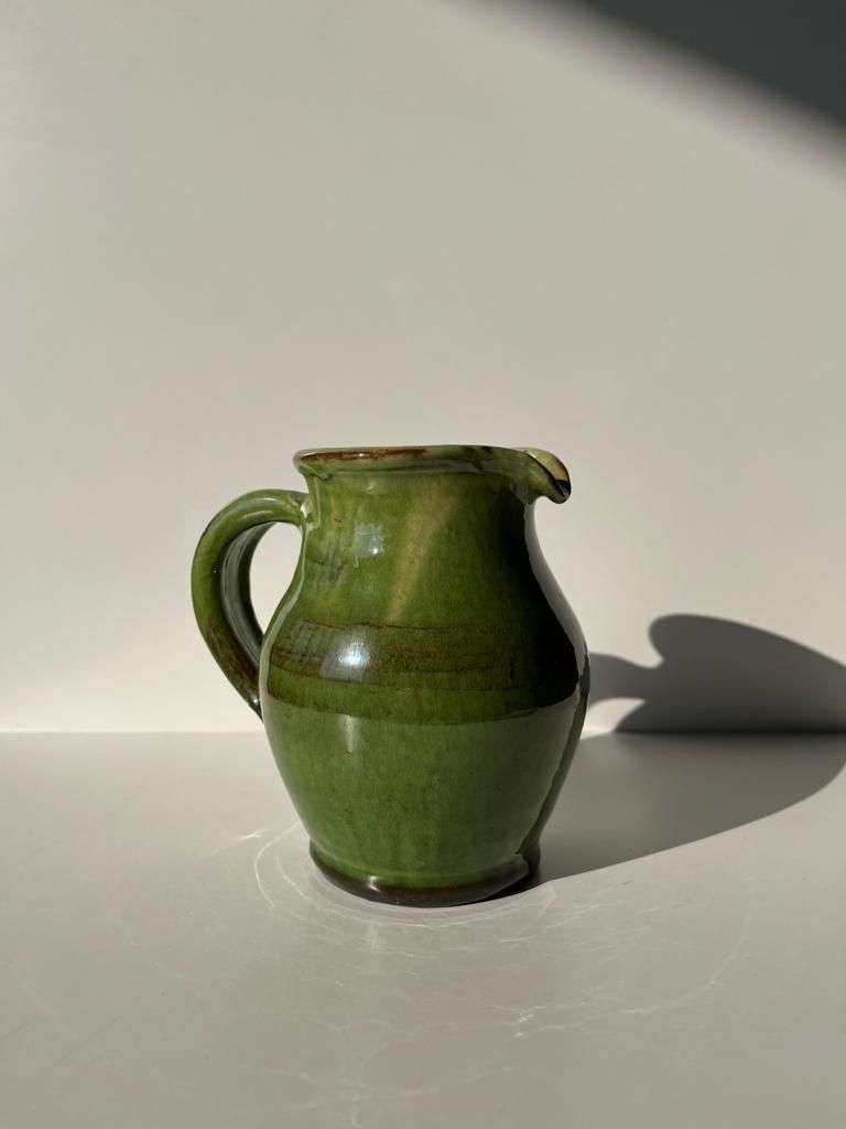 Green glazed ceramic pitcher