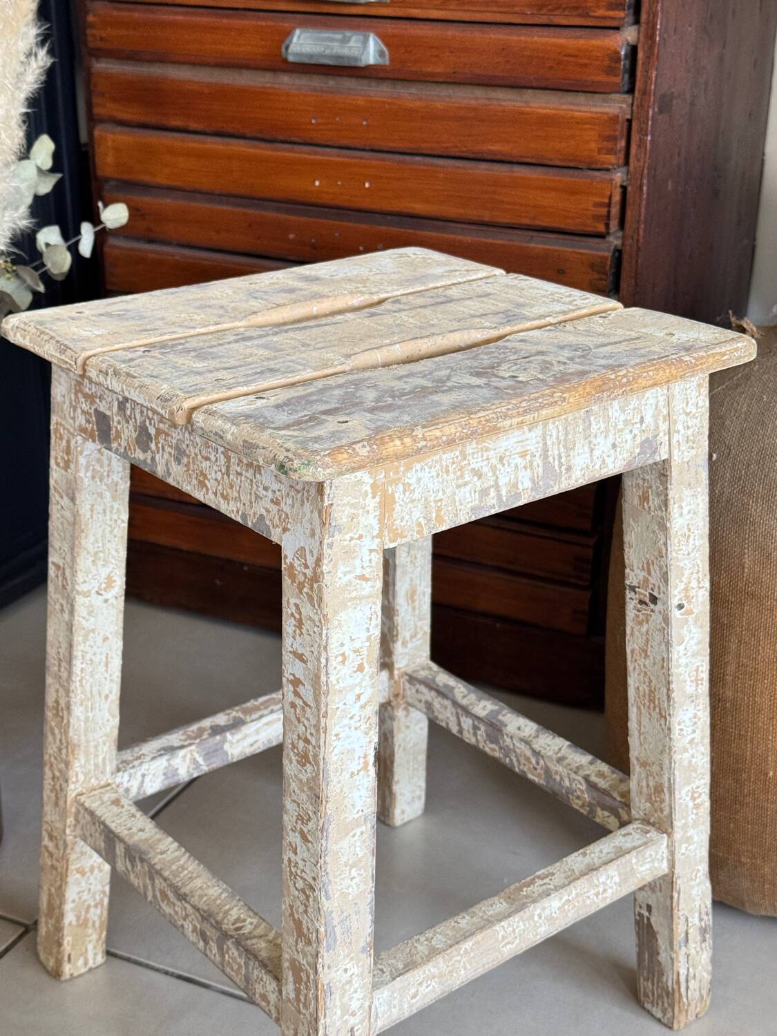 Old wooden stool with square seat