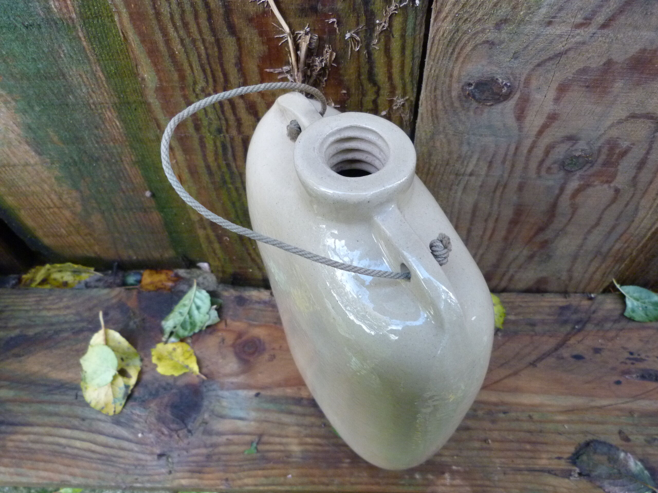 English sandstone hot water bottle dated 1942