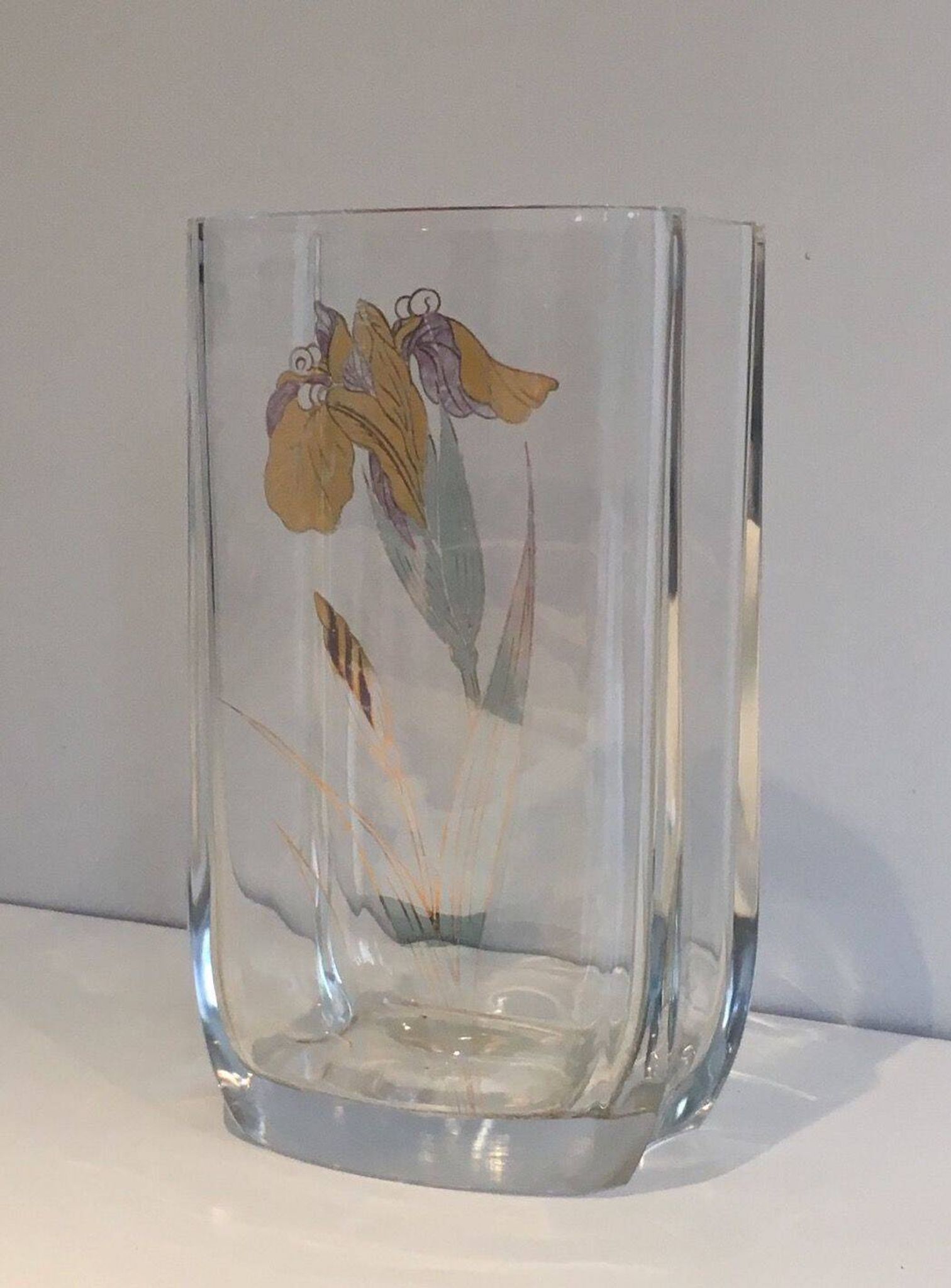 Glass vase with a decoration of a golden flower, around 1970.