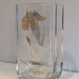 Glass vase with a decoration of a golden flower, around 1970.