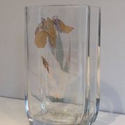 Glass vase with a decoration of a golden flower, around 1970.
