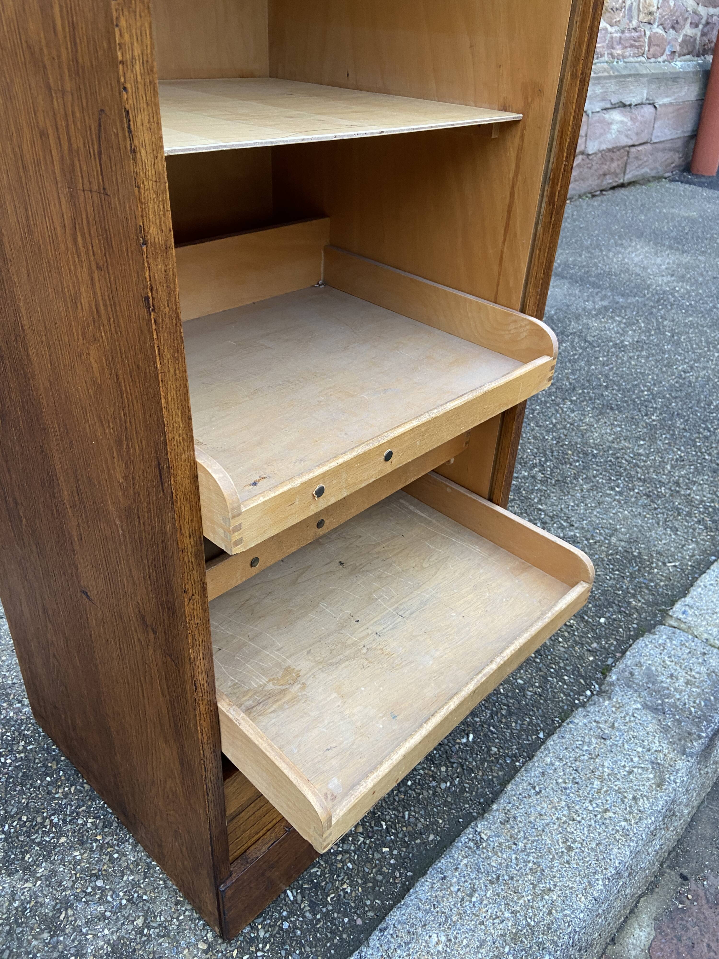 Sliding curtain binder cabinet