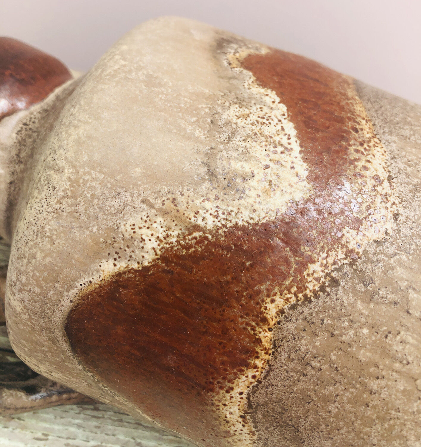 Ancient sided jug in flamed sandstone