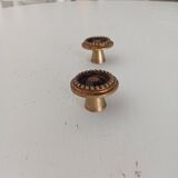Pair of antique furniture knobs in gilded brass.