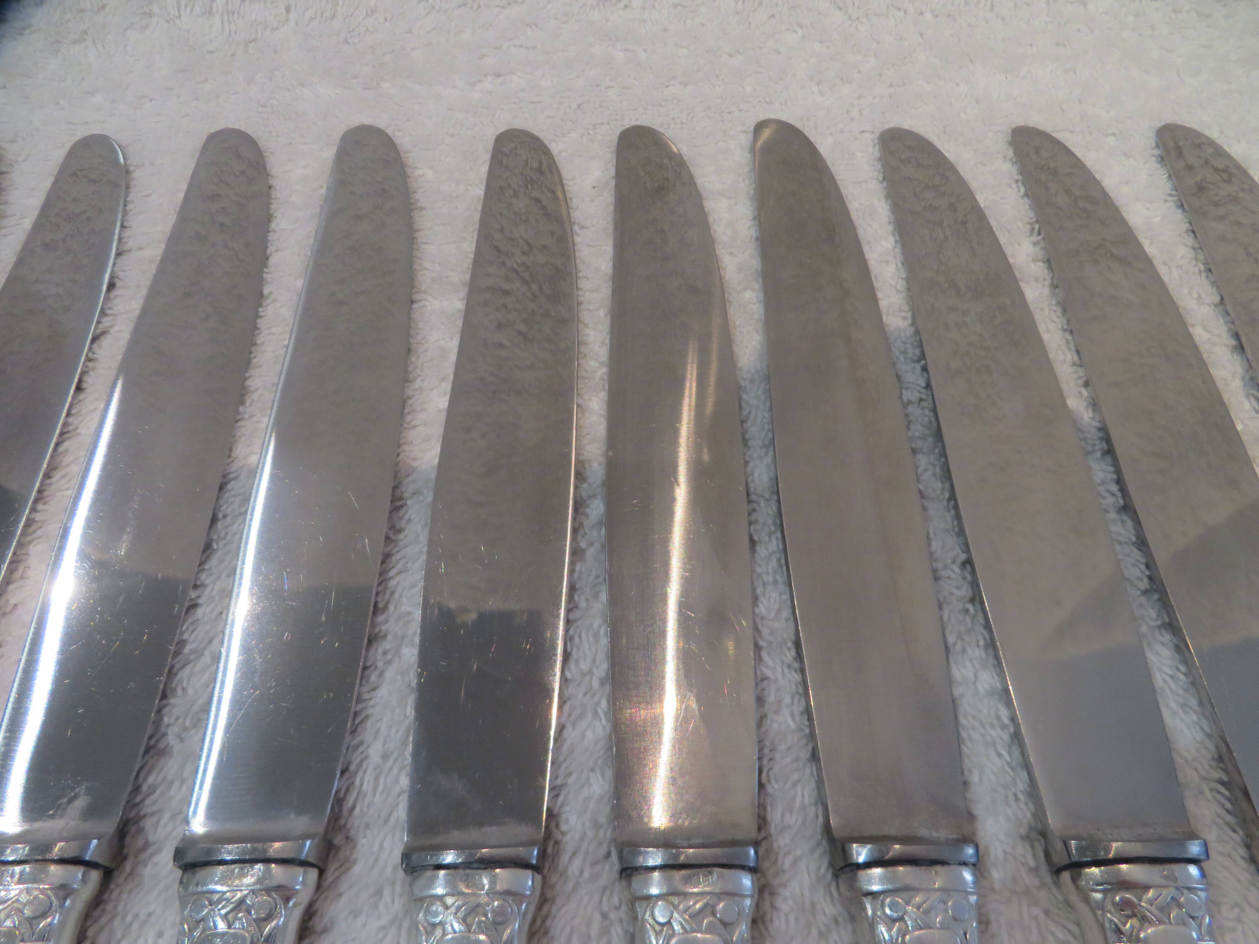 12 silver plated table knives by Argit goldsmith? Art Deco floral bands