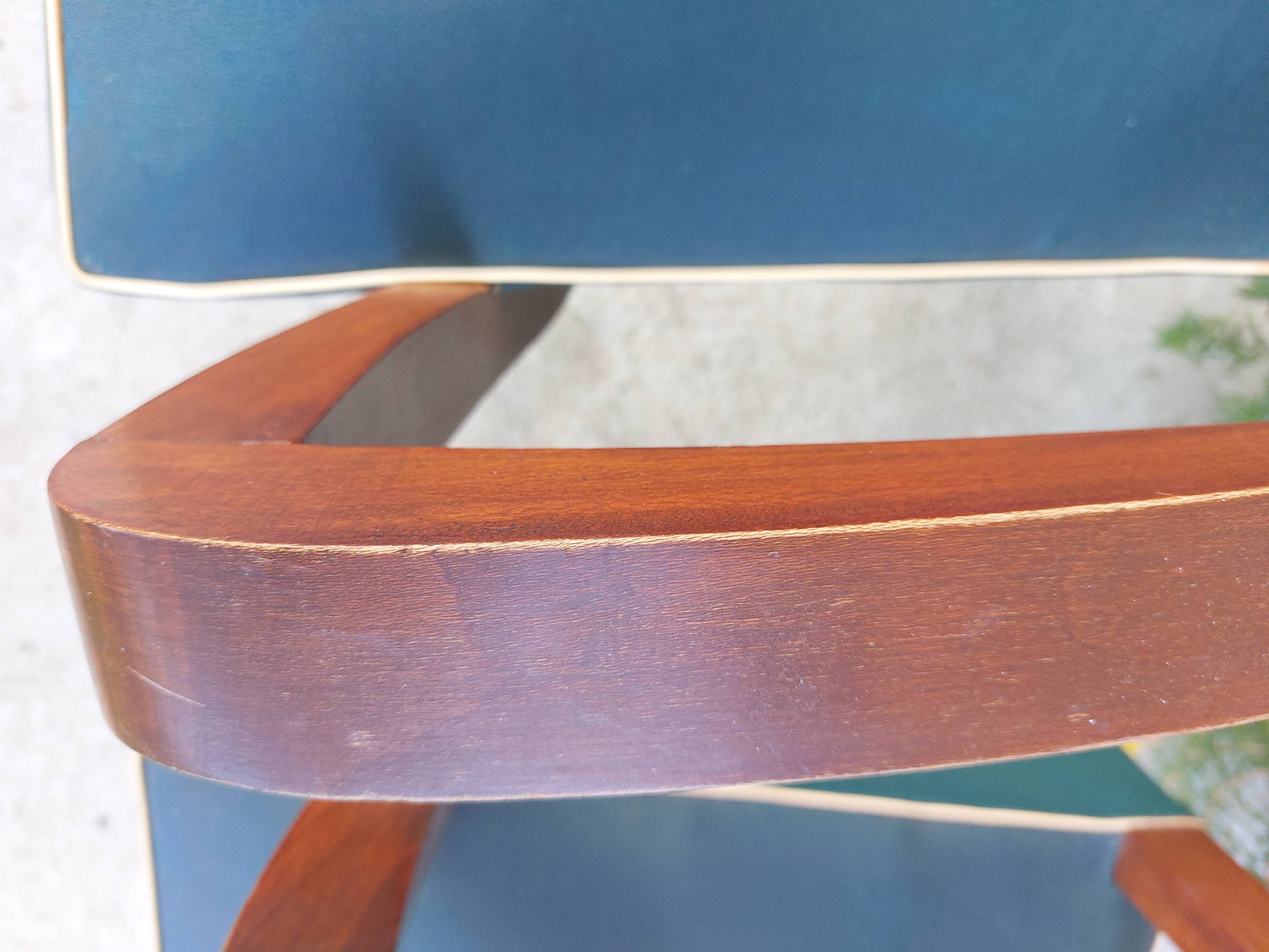 pair of dark green bridge armchairs