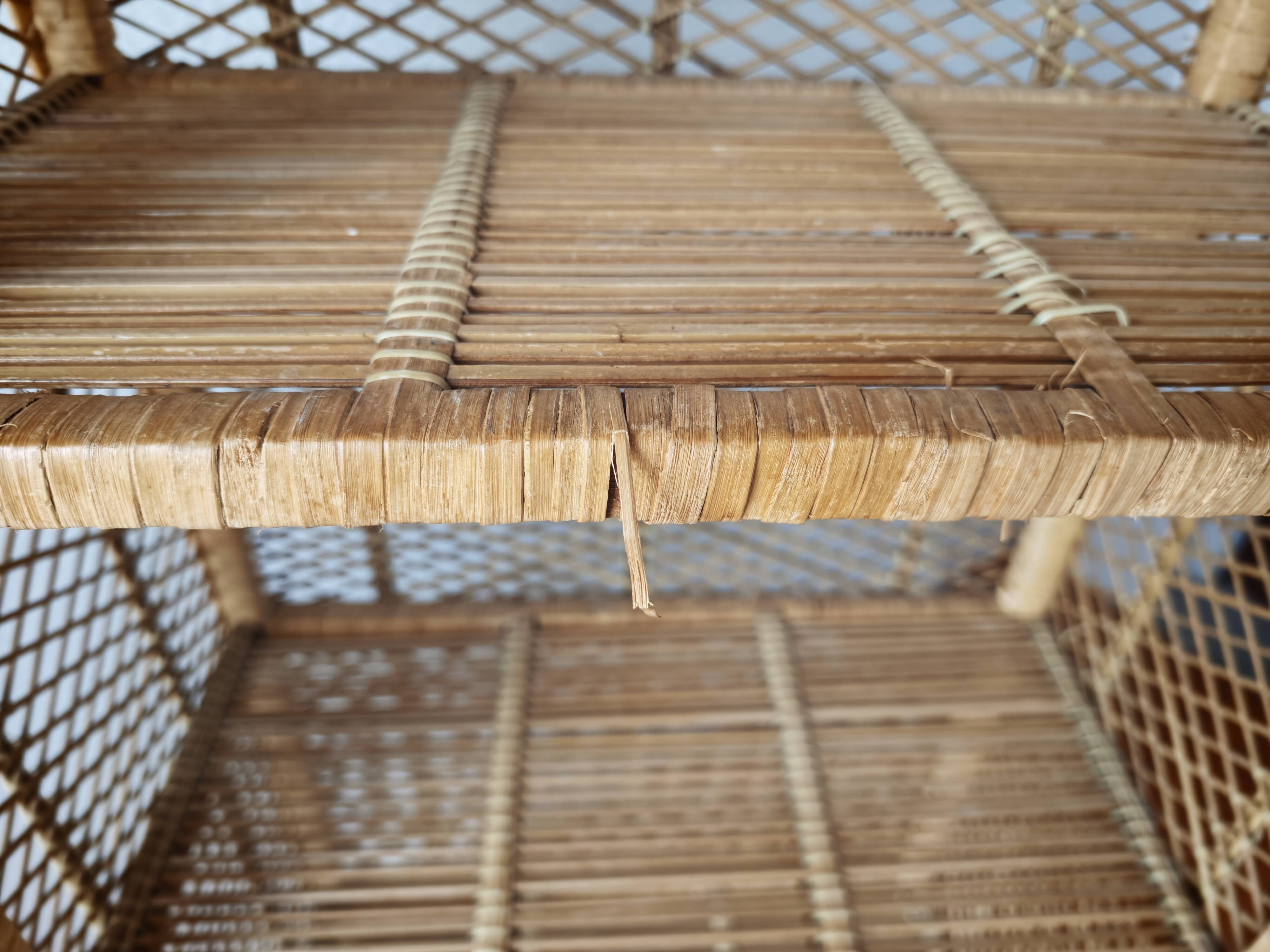 Rattan shelf on legs circa 1960