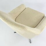 Cream corduroy swivel shell armchairs