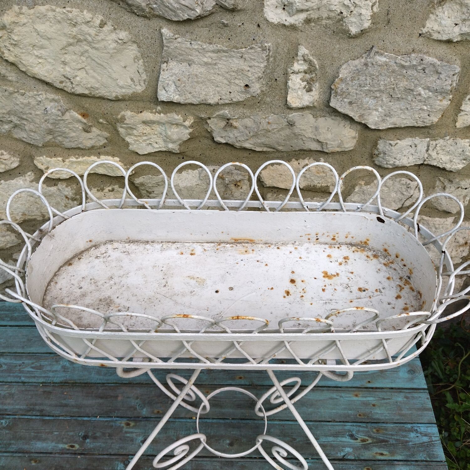 Wrought iron plant holder from the 1950s