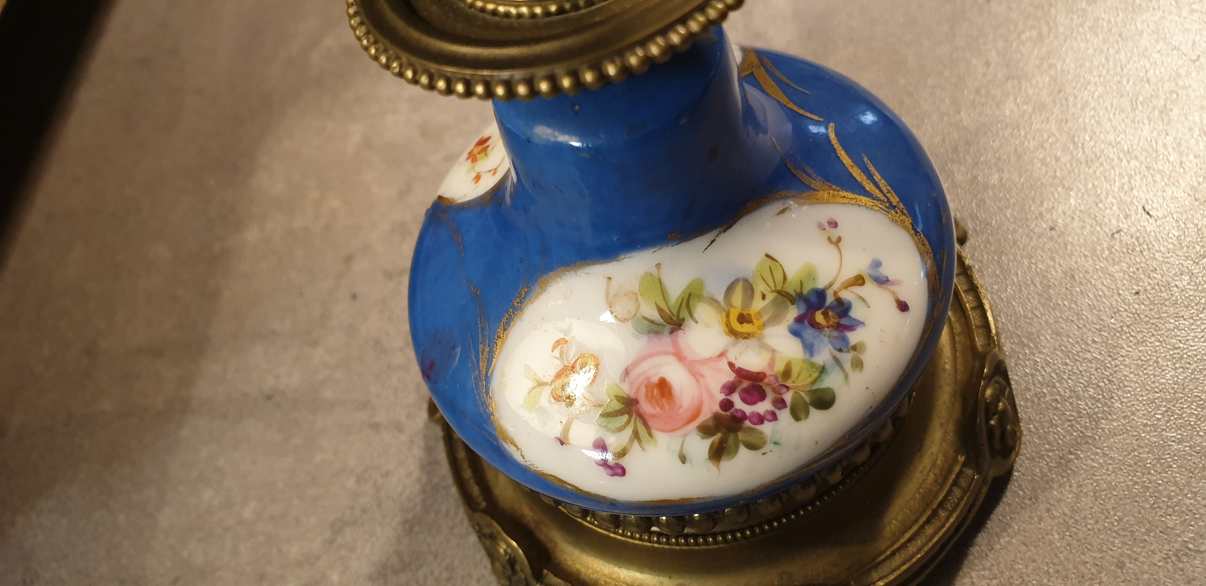 Pair of xixth candle holders, in bronze and enamelled porcelain
