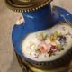 Pair of xixth candle holders, in bronze and enamelled porcelain