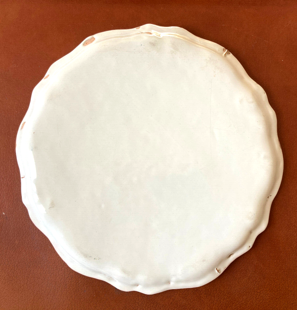 Old round dish in Lyon faience decorated with yellow roses
