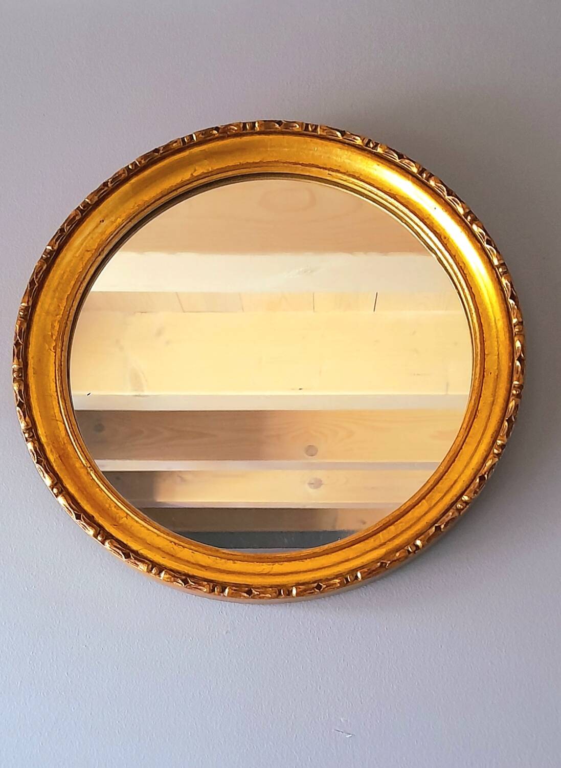 Round golden mirror